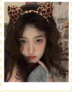 Detailed close-up of a stylish leopard print cat ear headband for Halloween party costumes