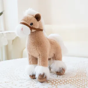 Realistic brown and white plush horse toy standing on a lace tablecloth