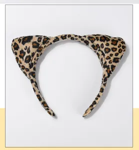 Detail shot of plush leopard print cat ear headband for Halloween cosplay costumes