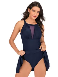 Elegant navy blue one-piece skirted swimsuit with mesh insert and tummy control feature.