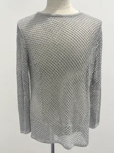 Detail showing the grey mesh knit texture of a long sleeve crew neck sweater top