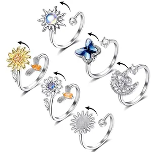 Set of six rotating fidget rings for anxiety relief with flower and star motifs