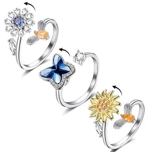 Set of three spinner rings featuring flower and butterfly designs for anxiety relief.