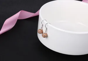 Detail shot of Shamballa crystal ball earrings in champagne gold on S925 silver hooks