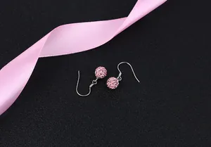 Close-up of elegant pink Shamballa crystal ball dangle earrings with S925 silver hooks
