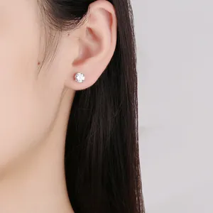 Elegant S925 sterling silver four-claw zircon stud earrings for women.