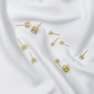 S925 sterling silver gold-plated four-prong cubic zirconia stud earrings in various sizes.