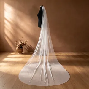 Pure white long single-layer trailing bridal veil showing elegant draping and length