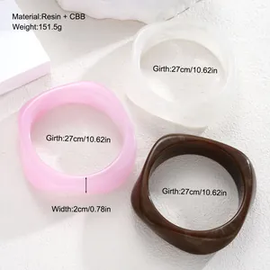 Detailed size guide for three-piece chunky irregular resin bangles in pink white and brown