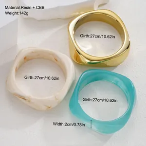 Chunky irregular resin bracelet set in gold, cream, and turquoise with size specs