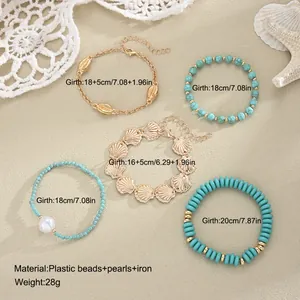 Bohemian 5-piece beaded and gold-tone shell bracelet set for summer beach style jewelry.