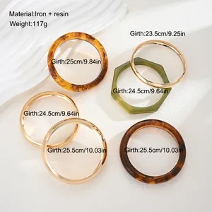 Set of six various resin and metal bracelets with detailed girth measurements displayed