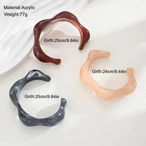 Irregular acrylic open bangle bracelets in three colors showing girth measurements