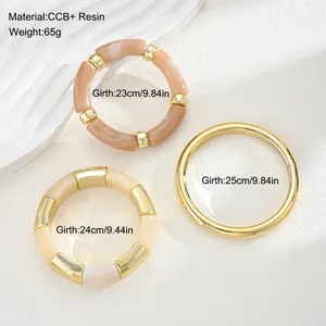 Detailed close-up of a three-piece resin and gold-tone chunky bracelet set measurements