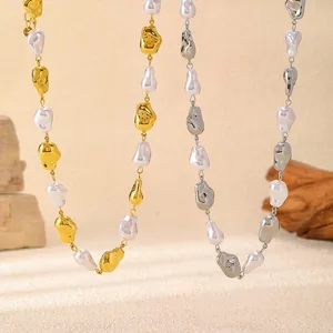 Detailed macro view of baroque pearl necklaces in gold and silver metallic finishes