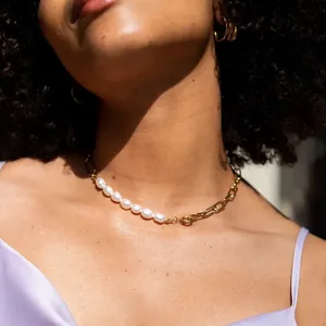 Close-up of a 18k gold plated chain necklace featuring natural freshwater pearls