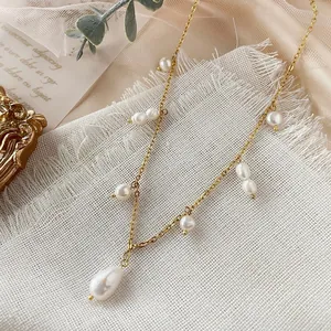 Detailed macro shot of an 18k gold plated stainless steel necklace with natural freshwater pearls.