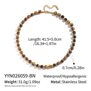 Macro view of tiger eye stone necklace with stainless steel chain details and measurements.