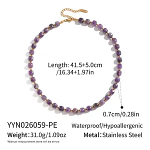 Macro shot of purple natural stone necklace with stainless steel gold chain detail