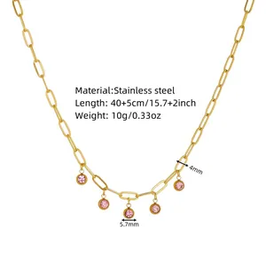 Detail view of a gold stainless steel necklace featuring pink stone charms and 4mm chain links