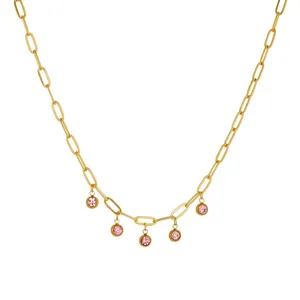 Close-up of gold PVD plated titanium steel necklace with pink crystal charms.