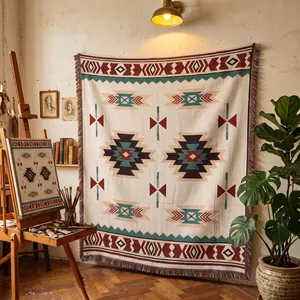 Couverture bohème aux motifs ethniques présentée dans un décor d'atelier d'artiste.