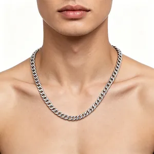 Close-up detail of a silver stainless steel Cuban link chain necklace on a male model