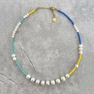Detailed view of handmade freshwater pearl necklace with colorful seed beads