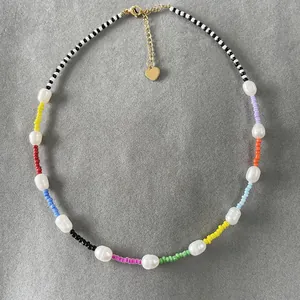 Detail showing the handmade colorful seed beads and genuine freshwater pearls necklace.