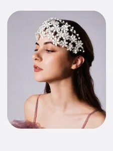 Close-up of white handmade floral headband worn by a model for wedding or party