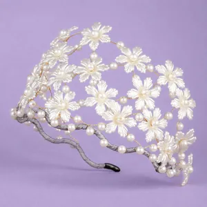 Elegant handmade pearl flower bridal headband with French luxury style for weddings and parties.