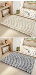 Detail showing soft cream and grey chenille bath mats in a modern bathroom setting