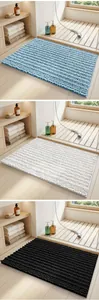 Multi-color chenille bath mat set showcasing soft texture in modern bathroom setting.