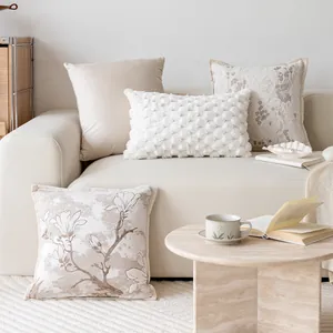 Elegant cream style sofa pillow covers with floral and textured patterns in living room