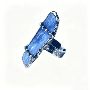 Detailed close-up of a raw blue kyanite crystal ring with a textured antique silver finish