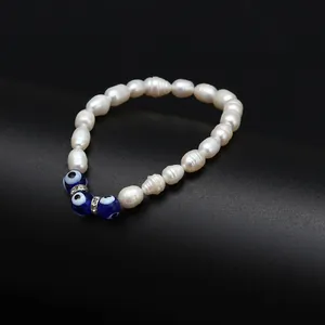 Élégant bracelet en perles d'eau douce avec perles d'œil bleu porte-bonheur en verre