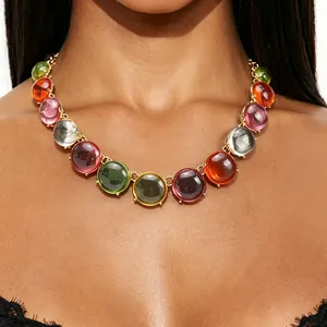 Close-up detail of a bohemian colorful jelly stone choker necklace worn by a model