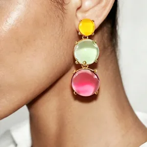 Detailed close-up showing bohemian colorful jelly geometric drop earrings worn on an ear