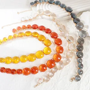 Detailed view of bohemian necklaces featuring colorful translucent jelly-like beads.