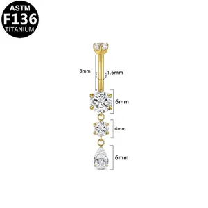 Gold F136 titanium belly ring featuring clear zircon teardrop and round stone dangles.