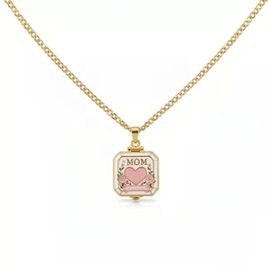 Detail view of a square gold locket necklace with a pink heart and Mom engraving