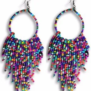 Vibrant bohemian-style hoop earrings featuring colorful beaded tassels on white background.