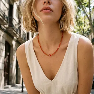 Premium handmade red evil eye beaded necklace with semi-precious stones on female model