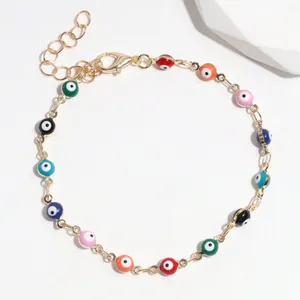 Adjustable gold chain bracelet featuring colorful Evil Eye beads in various shades