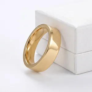 Macro view of a polished 14K gold plated stainless steel band ring against a jewelry box.