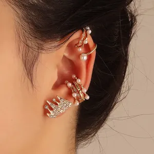 Vintage 5-piece jewelry set featuring pearl ear cuffs and a sparkling crown stud