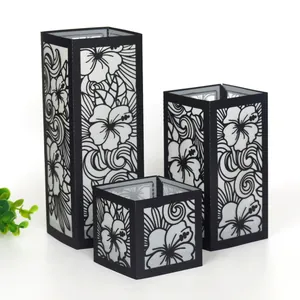 Détails de trois lanternes en papier hibiscus noir découpées au laser de tailles