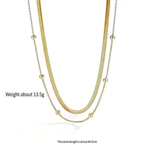 Elegant double-layered gold necklace with herringbone chain and bead chain details