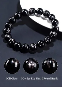 Macro detail of natural black hypersthene beads showing golden sheen and texture bracelets.