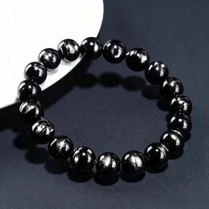 Natural black bronzite hypersthene beaded bracelet with golden sheen on dark surface